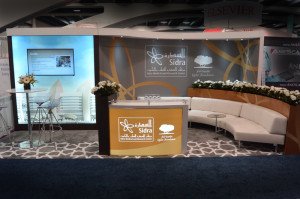 custom exhibit booth with supernova led backlit graphics walkin storage and reception counter