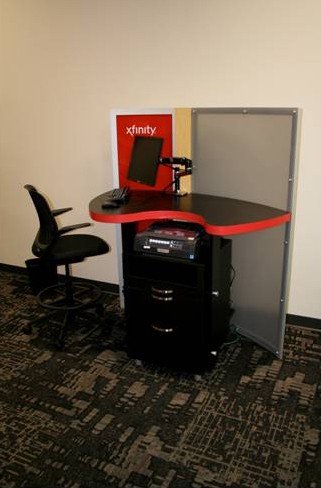 Small Retail Store Display - Xfinity display with small desk and chair.