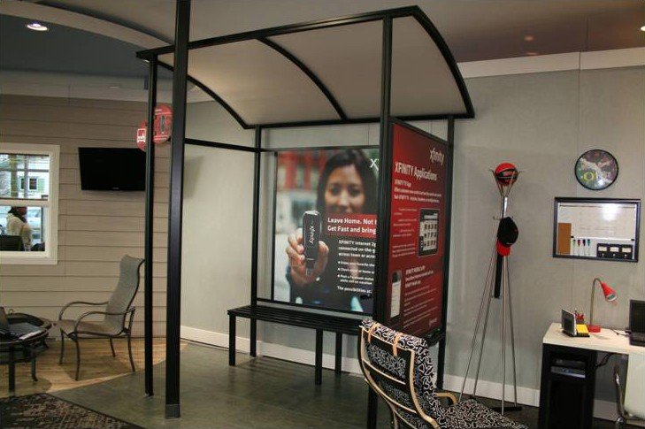 Retail Store Display - Xfinity display with informational graphics and integrated seating.