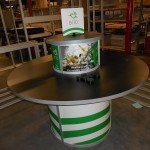 Custom Round Demo Counter with Laminated Top and Rotating Sign