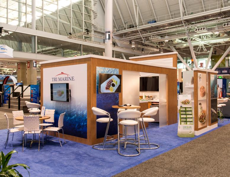 custom trade booth displays - island exhibit with kitchen and meeting areas