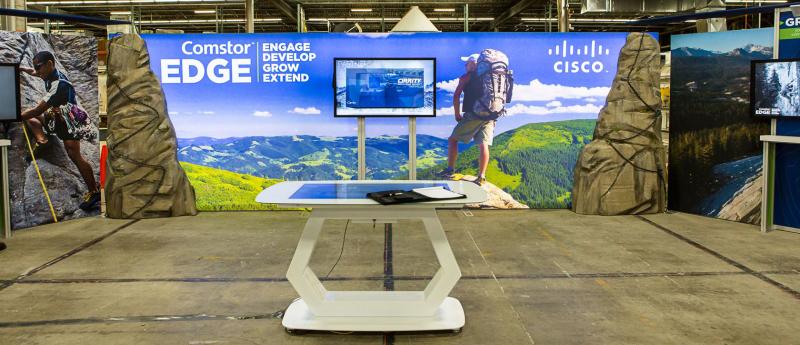 custom trade show displays - large lightbox with monitor stand and faux boulders