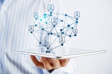 How To Use Social Media to Win at Trade Shows Social Media for Trade Show - Man with tablet